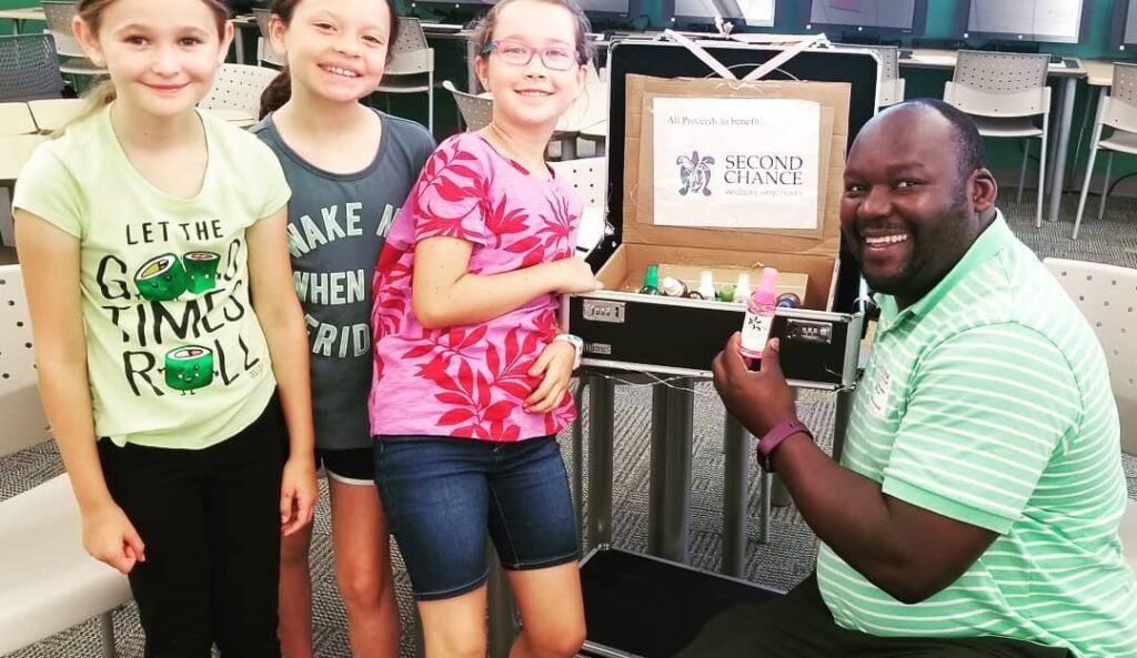 Young participants share a community-focused project during a hands-on learning activity.